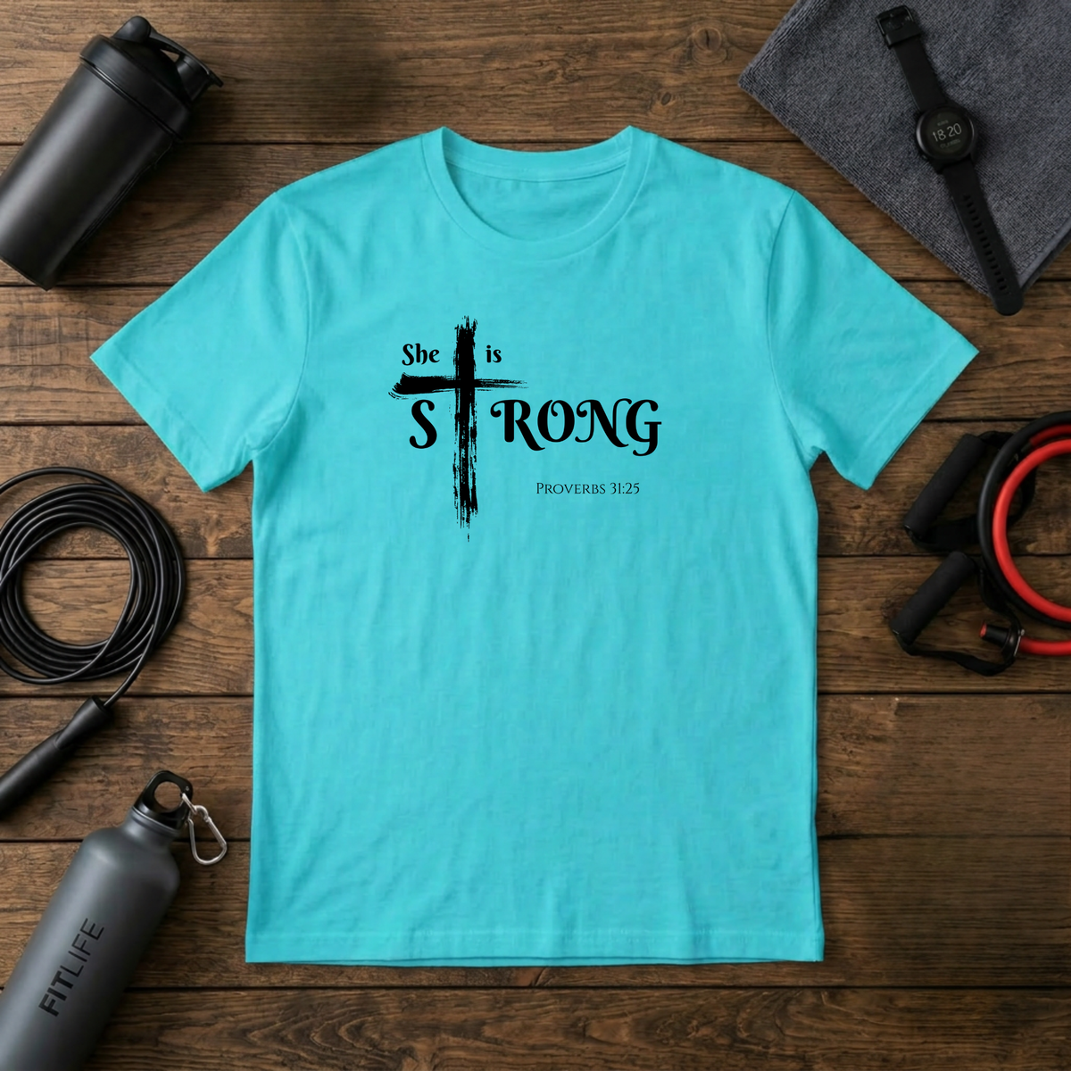 She Is Strong – Proverbs 31:25 Cross T-Shirt