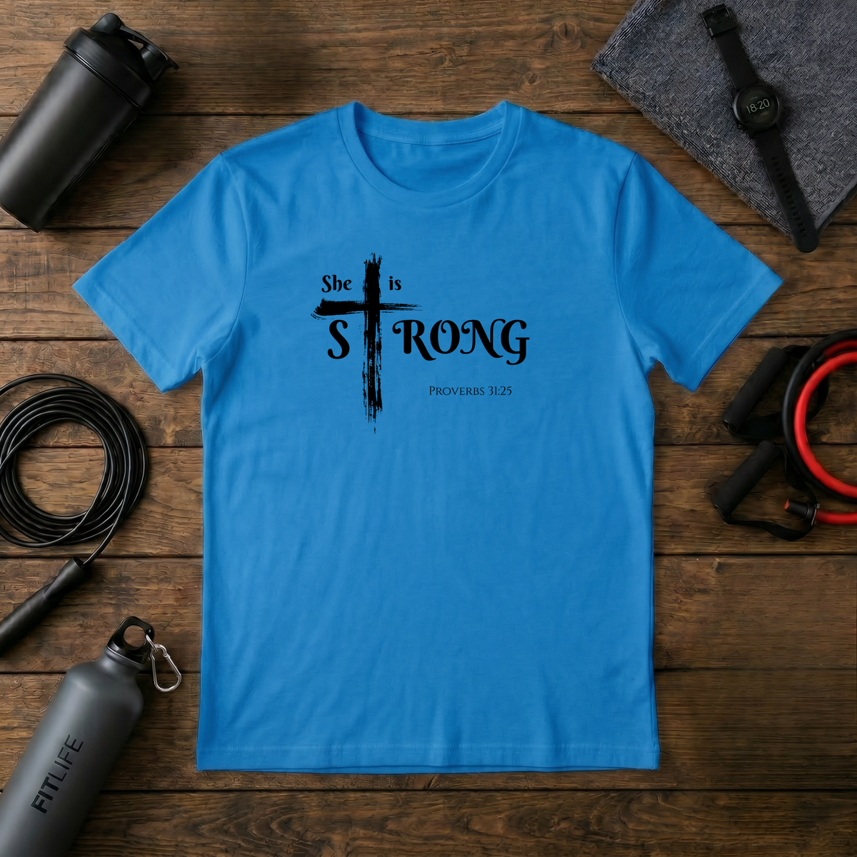 She Is Strong – Proverbs 31:25 Cross T-Shirt